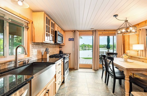 Alger Cottage | Stunning Lakefront Cottage with Beach & Hot Tub