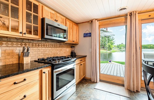 Alger Cottage | Stunning Lakefront Cottage with Beach & Hot Tub