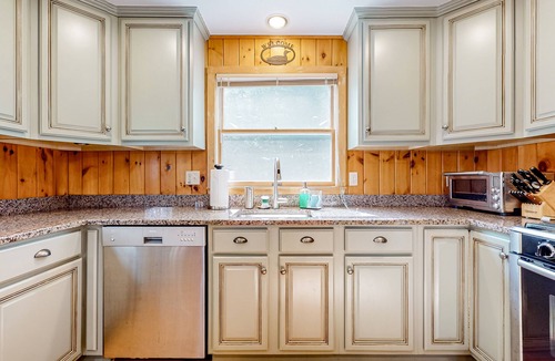 Pine River Pond House | Stunning lakefront home with private dock, deck, firepit, and lake view