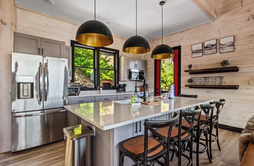 Sevierville Cabin | Stunning Mtn Lodge on Lake with two Story Dock, Indoor Pool, Arcade,and Hot Tub.