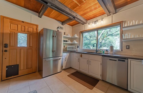 Salyer House | Stunning riverfront gem w/wraparound deck, beach access & game room