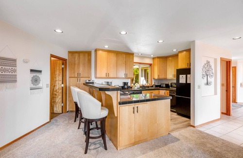 Oak Harbor House | Stunningly situated home with expansive deck & mountain/water views