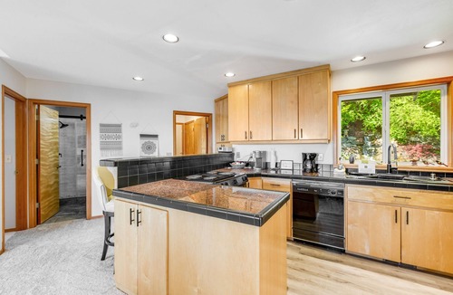 Oak Harbor House | Stunningly situated home with expansive deck & mountain/water views