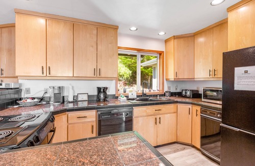 Oak Harbor House | Stunningly situated home with expansive deck & mountain/water views