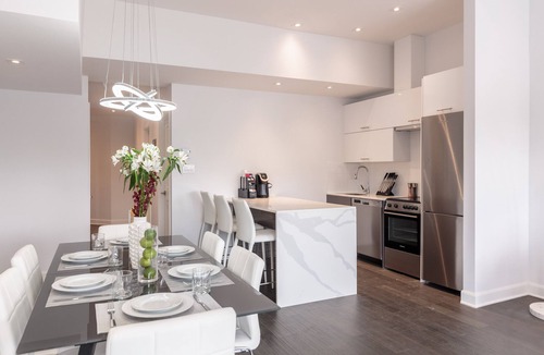 Mile End Condo | Stylish 4-Bedroom Condo with Private Deck & Hot Tub!