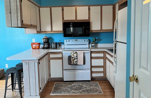 Sea Scape Condo | Stylish Coastal Retreat in the Heart of the OBX n2BR 2BA Pool Tennis Patio WiFi