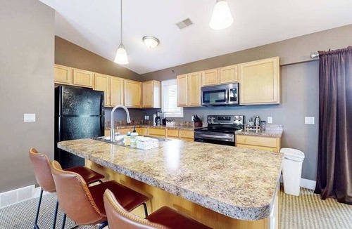 Douglas Condo | Stylish dog-friendly retreat with furnished deck, pool, & firepits