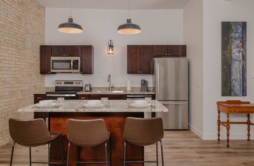 Neenah Apartment | Stylish Downtown Neenah Flat - Walk to Everything!
