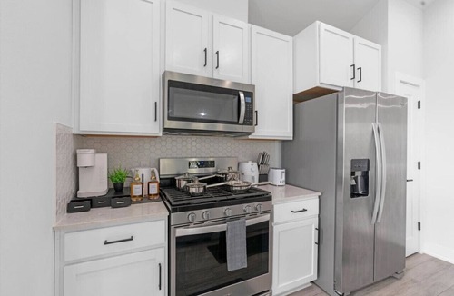 University Hills and Windsor Park Villa | Stylish Downtown Retreat w/Balcony, Reserved Parking + Walkable Access
