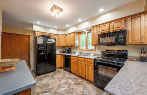 Oakland House | Stylish Lake Retreat w/Hot Tub, Dock & Fire Pit