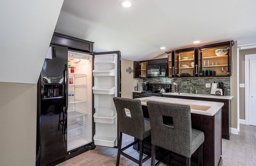 Huntington Station Apartment | Stylish Upscale Apt w/Snack Bar & Sunny Deck