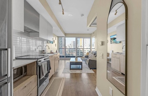 Garden District Apartment | Suite Mia: Medical District 2BR Walk to St. Mike’s