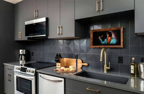 Rolling Mill Hill Apartment | Summer rooftop deck, skyline views, indoor-outdoor living near Broadway