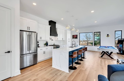 Hurwood Heights House | Summer rooftop hot tub, game room, sauna near Broadway and Geodis Park