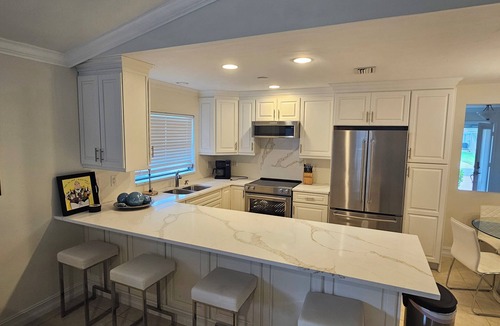 Naples Park House | SUMMER SPECIALS! Amazing Pool Oasis, Close 2 Beach, FREE Bikes, Full Amenities