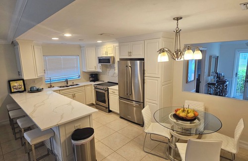 Naples Park House | SUMMER SPECIALS! Amazing Pool Oasis, Close 2 Beach, FREE Bikes, Full Amenities