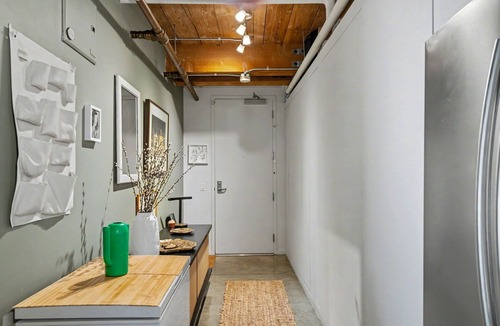 Arts District Condo | Sun-drenched, chef's kitchen, and beautifully collected, Arts District loft