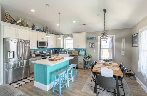 Colington House | Sun Realty pet-friendly centrally-located oceanside home in KDH!