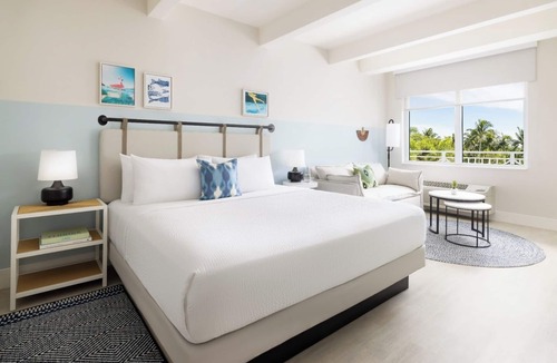 New Town Hotel | Sun, Sip, & Socialize | Island Stay with 2 Pools & Lawn Games