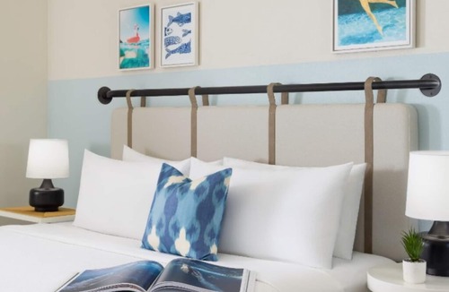 New Town Hotel | Sun, Sip, & Socialize | Island Stay with 2 Pools & Lawn Games