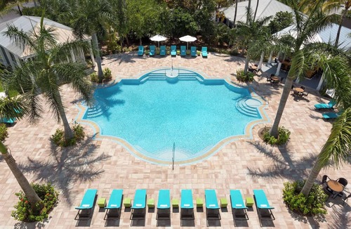 New Town Hotel | Sun, Sip, & Socialize | Island Stay with 2 Pools & Lawn Games