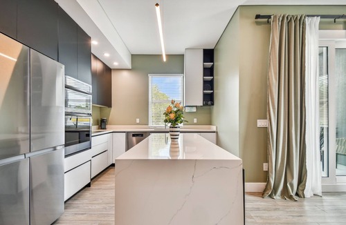 Crescent Lake Apartment | Sun Soaked Designer Condo with Patio