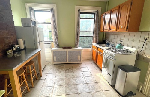 McGinley Square Apartment | Sunlit Brownstone Haven Near NYC