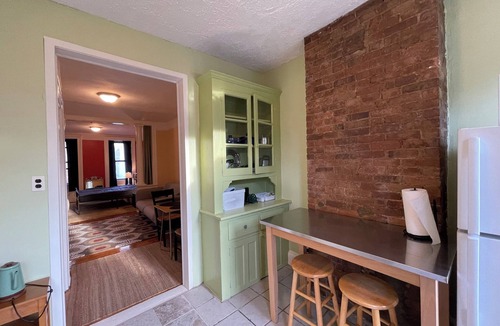 McGinley Square Apartment | Sunlit Brownstone Haven Near NYC