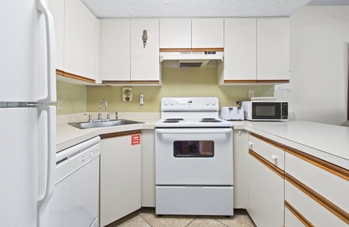 Cape Caneveral Beach Gardens Condo | Sunlit Ground‑Floor Corner Condo ☀️ Private Patio, Steps to Beach & Pool!