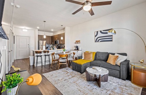 Vickery Meadow Apartment | Sunlit Midtown Suite Pool & Gym Bliss