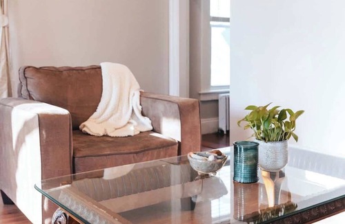 Off Broadway Apartment | Sunny 2BR/1BA with Front Porch & Parking