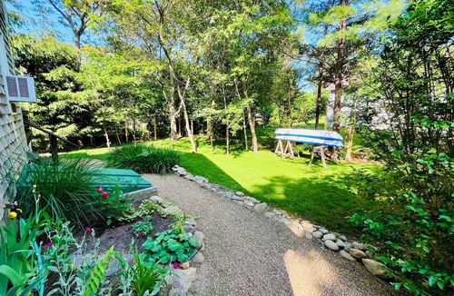 Lagoon Heights House | Sunny 3 bedroom cape with large deck, porch and kayaks. Pet friendly.