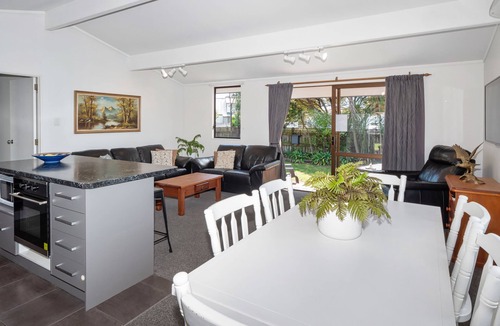 Papamoa Beach House | Sunny Beach Bach with peaceful backyard