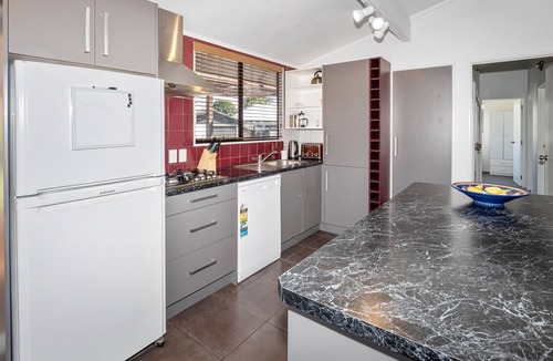 Papamoa Beach House | Sunny Beach Bach with peaceful backyard