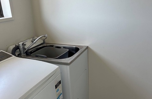 Papamoa Beach House | Sunny Papamoa beach bach- steps to the sand….