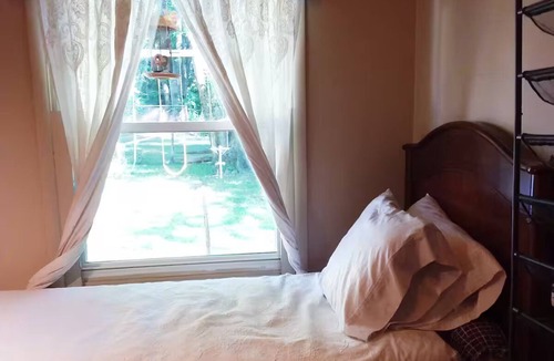 Irvington House | Sunny Window by the Bed