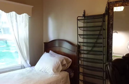 Irvington House | Sunny Window by the Bed