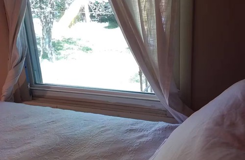 Irvington House | Sunny Window by the Bed