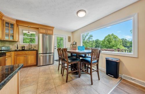Huddleston House | Sunrise Retreat - Sleeps 12, Lakefront Home with Hot Tub