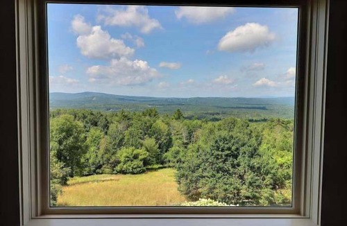Center Ossipee House | Sunset Slopes: A spacious 4-bedroom home in scenic Wilmot, NH, with garden views.