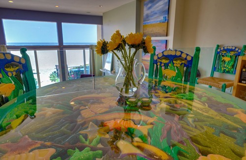 Marina Peninsula Condo | Sunsets and sweeping views, sliding doors open to the sand
