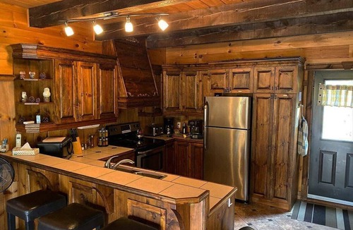 Entrelacs Ski Chalet | Super cute cedar chalet surrounded by the forest with access to water
