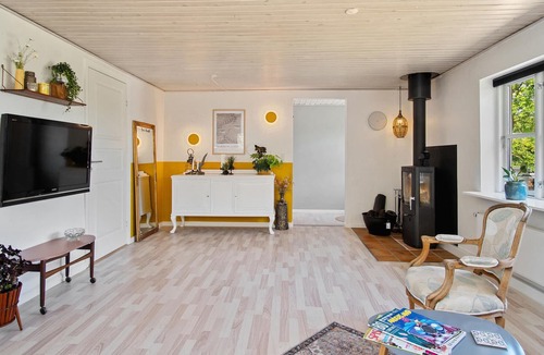 Vemmelev House | Surrounded by green meadows and fields, this inviting vacation home in Westseeland welcomes you.