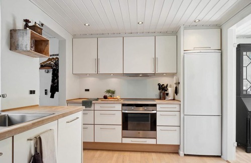 Vemmelev House | Surrounded by green meadows and fields, this inviting vacation home in Westseeland welcomes you.