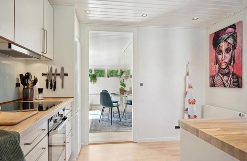 Vemmelev House | Surrounded by green meadows and fields, this inviting vacation home in Westseeland welcomes you.