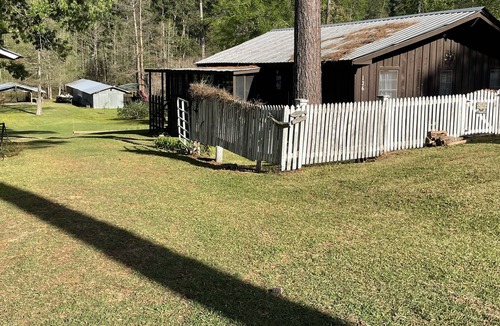 Negreet Cottage | Take a break and unwind on our waterfront screened in porch