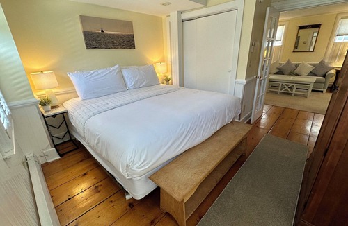 Newport Hotel | Take over this entire private historic Howland House, in the heart of downtown Newport—5BR/5BA inn sleeps 17 with king beds, pull-outs, full kitchen, ensuite baths, private patio, AC, TVs, Wifi and so much more! Steps to Thames Street, shops, wharfs