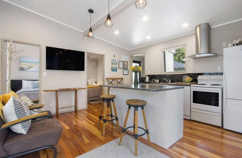 Waihi Beach Cottage | Te Mahana Cottage - pool & private spa, beachfront