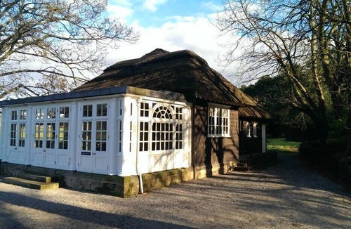 Thornton Hough Cottage | Thatched Pavilion including Hot Tub