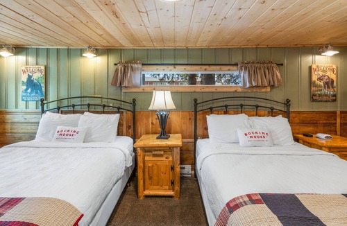 West Yellowstone Hotel | The Bucking Moose Wolf Suite: Cozy 2 Queen suite, just 1 minute from Yellowstone!